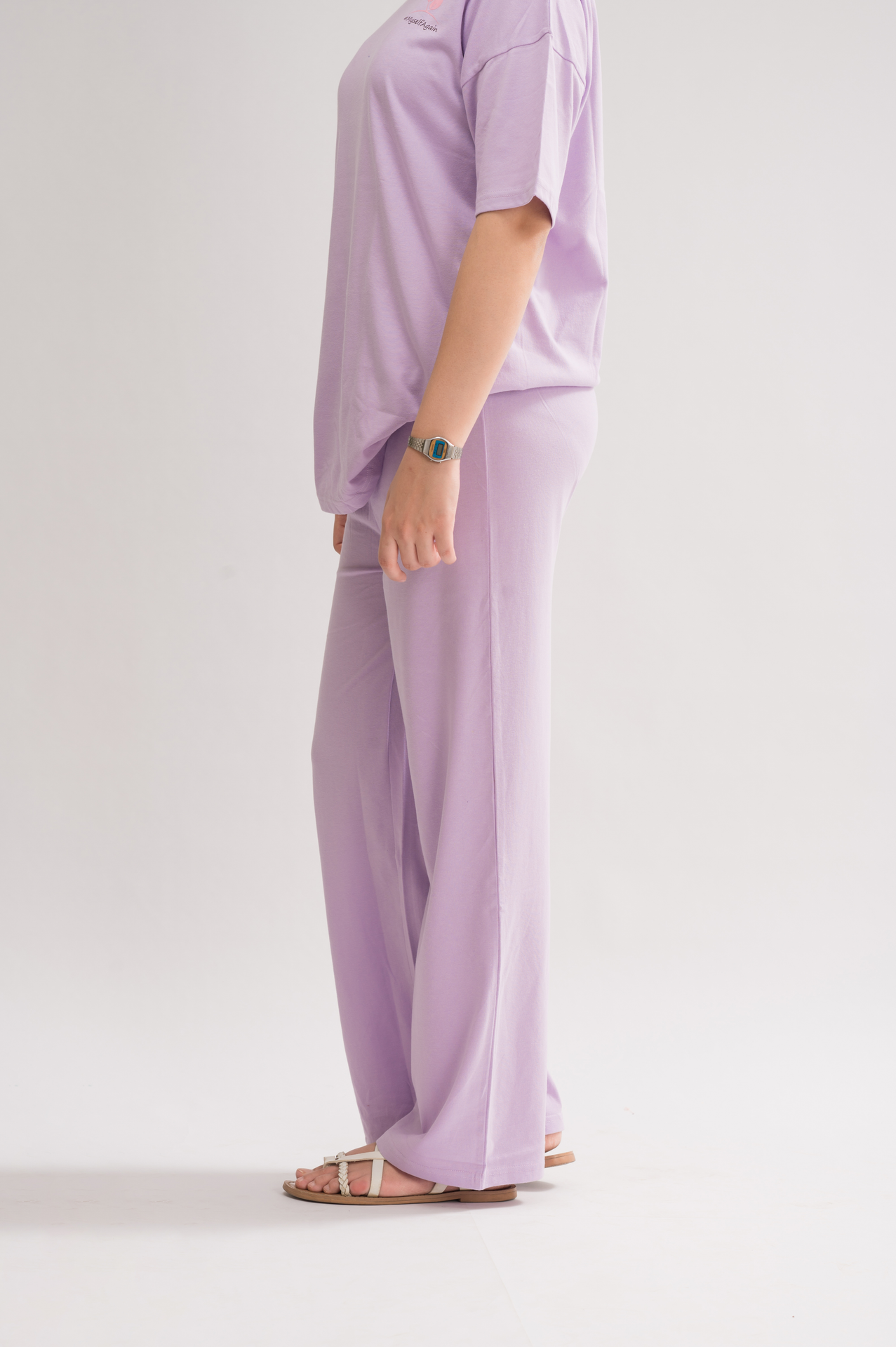 Side view of stylish trousers collection, highlighting the relaxed fit and straight fit designs for men and women.