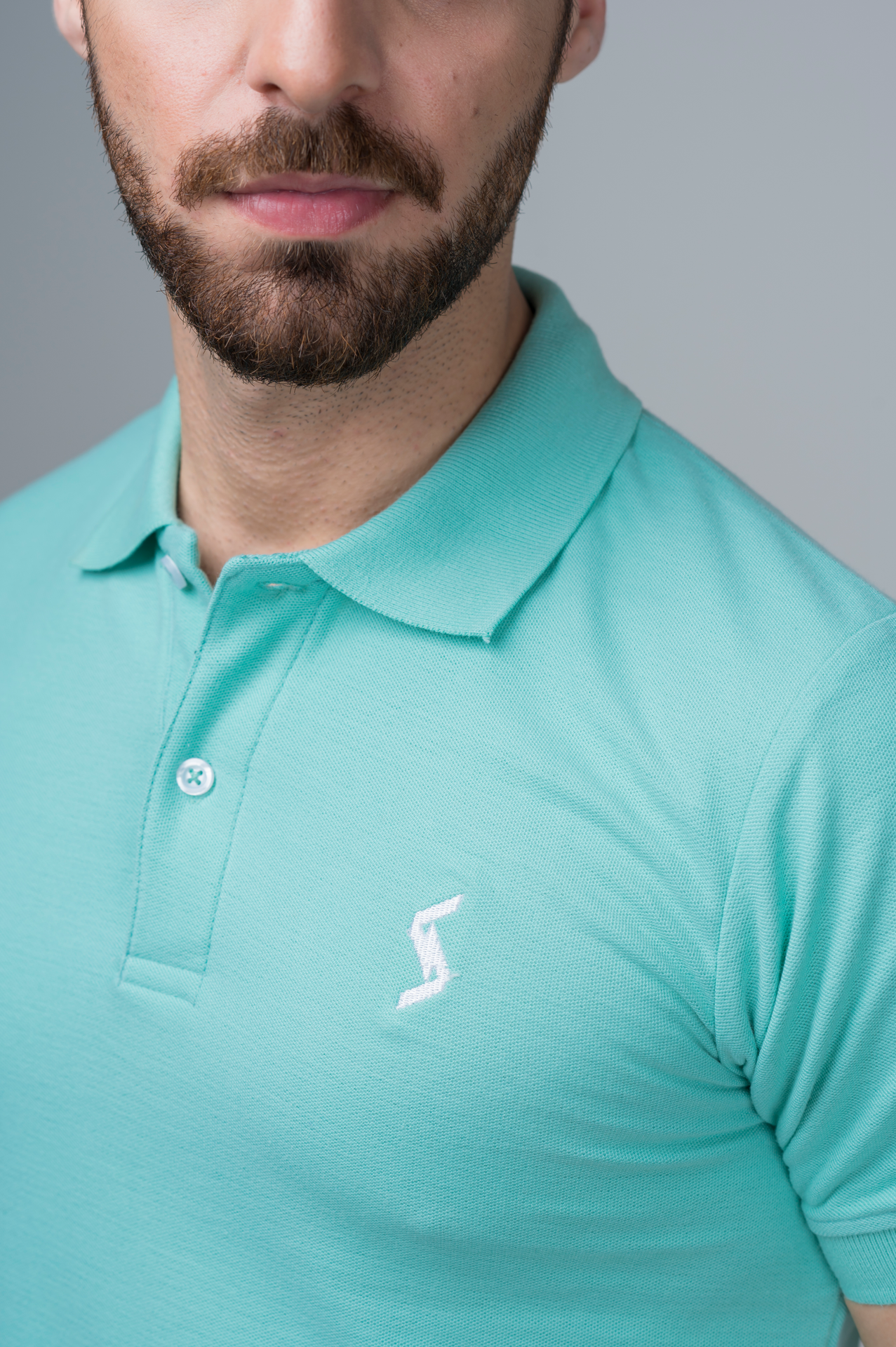 Close-up of Beveled Glass Classic Polo material, highlighting soft and breathable fabric for ultimate comfort.