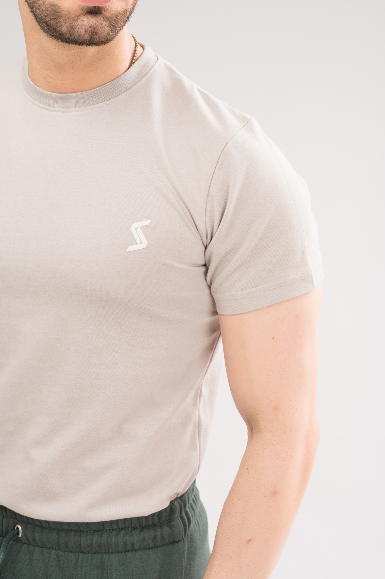 Close-up of Cloud Regular Fit T-Shirt material, highlighting soft fabric and printed logo detail.