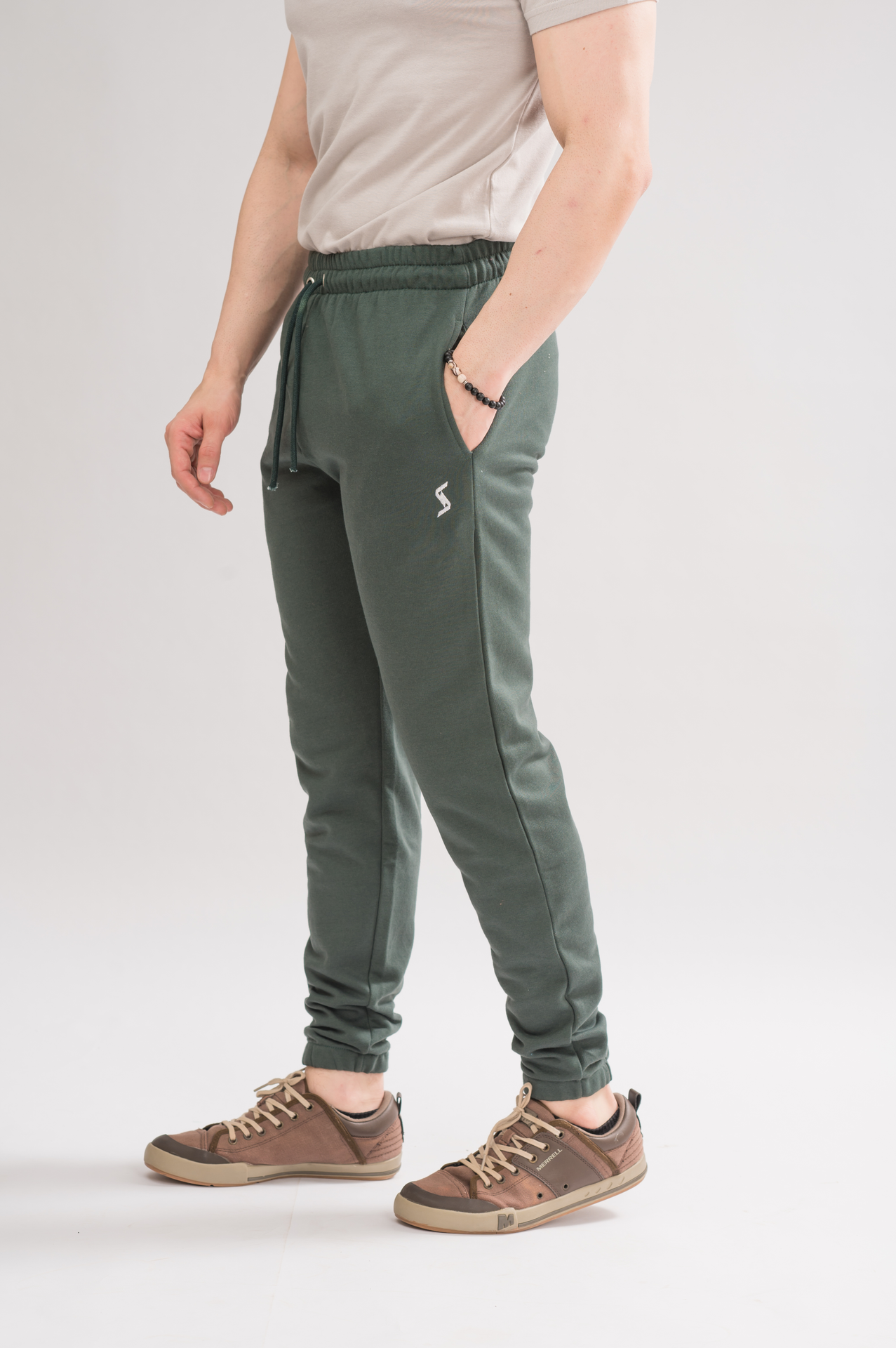 Side view of Men’s Moss Green Elastic Waist Relaxed Fit Trouser, showcasing the effortless relaxed fit.