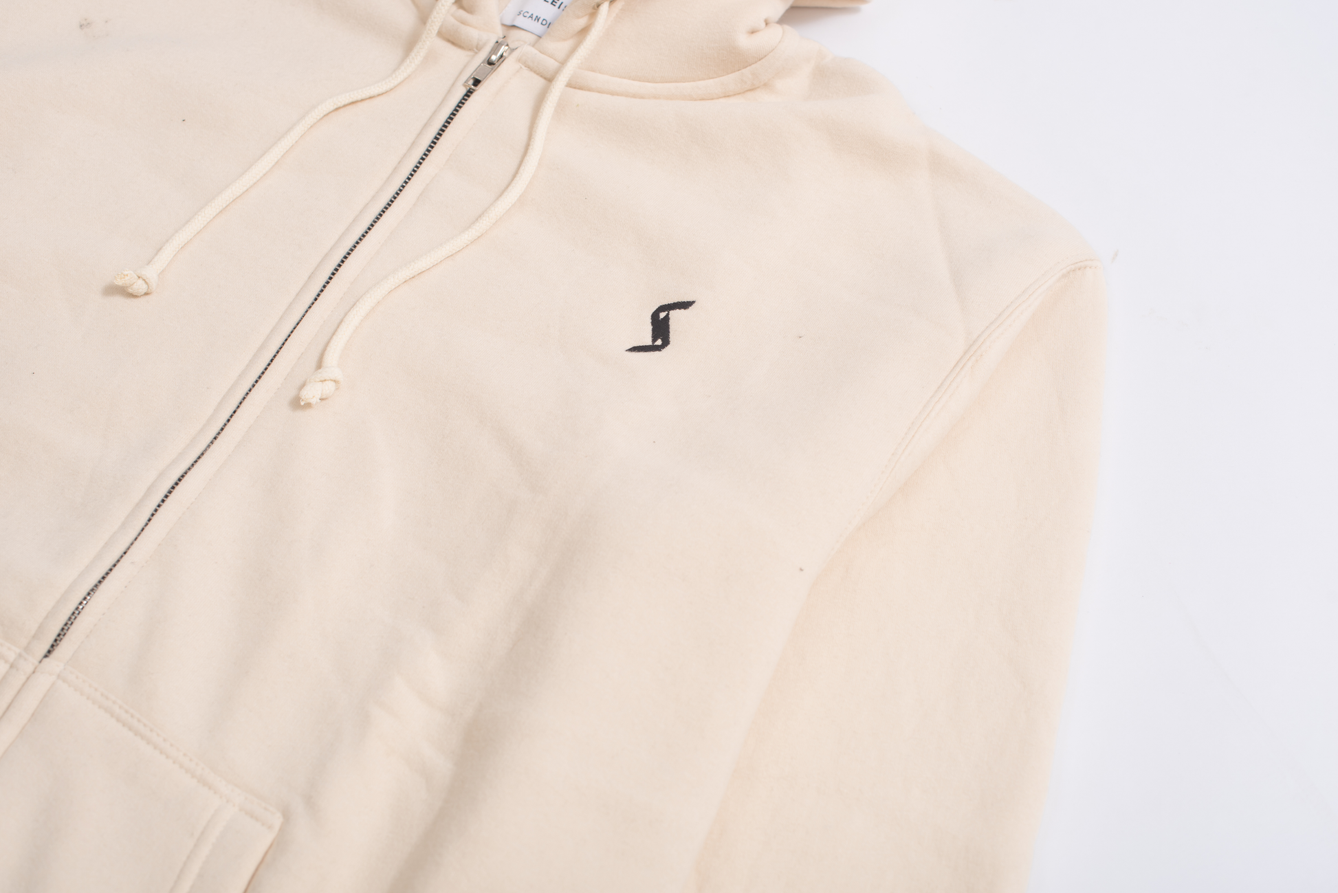 Close-up of Moon Beam Classic Zip-Up Hoodie, showcasing brushed interior for unparalleled softness and cozy feel.