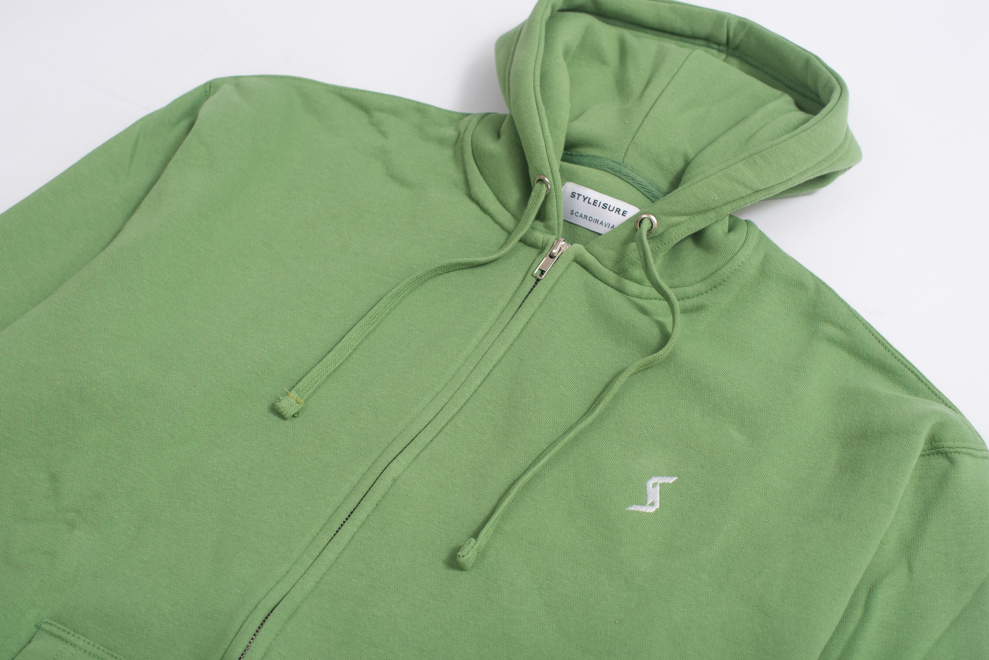 Close-up of Stone Green Classic Zip-Up Hoodie, showcasing brushed interior for unparalleled softness and cozy feel.