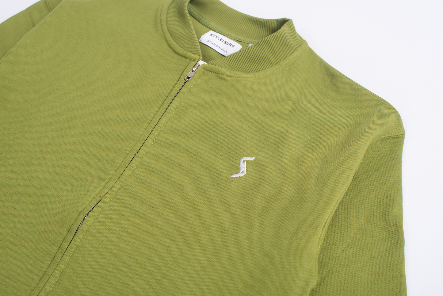 Close-up of Calla Green Cotton Fleece material, showcasing soft and high-quality fabric.