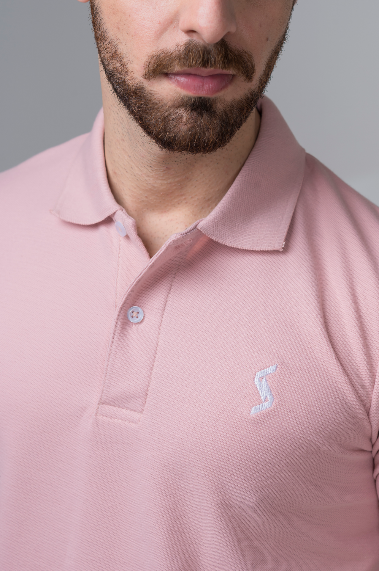 Close-up of Spanish Villa Classic Polo material, highlighting soft and breathable fabric for ultimate comfort.