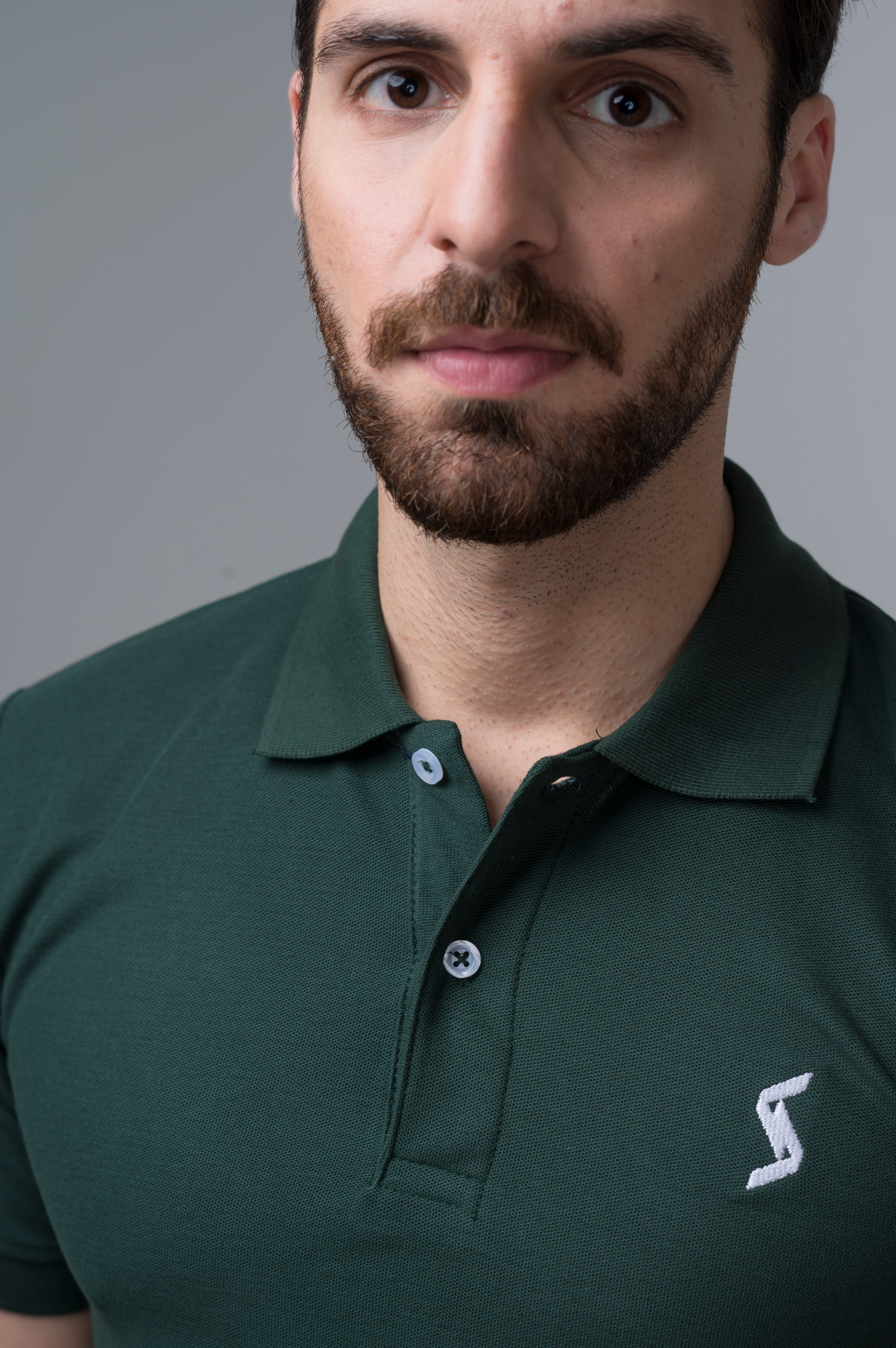 Close-up of Dark Moss Green Classic Polo material, highlighting soft and breathable fabric for ultimate comfort.