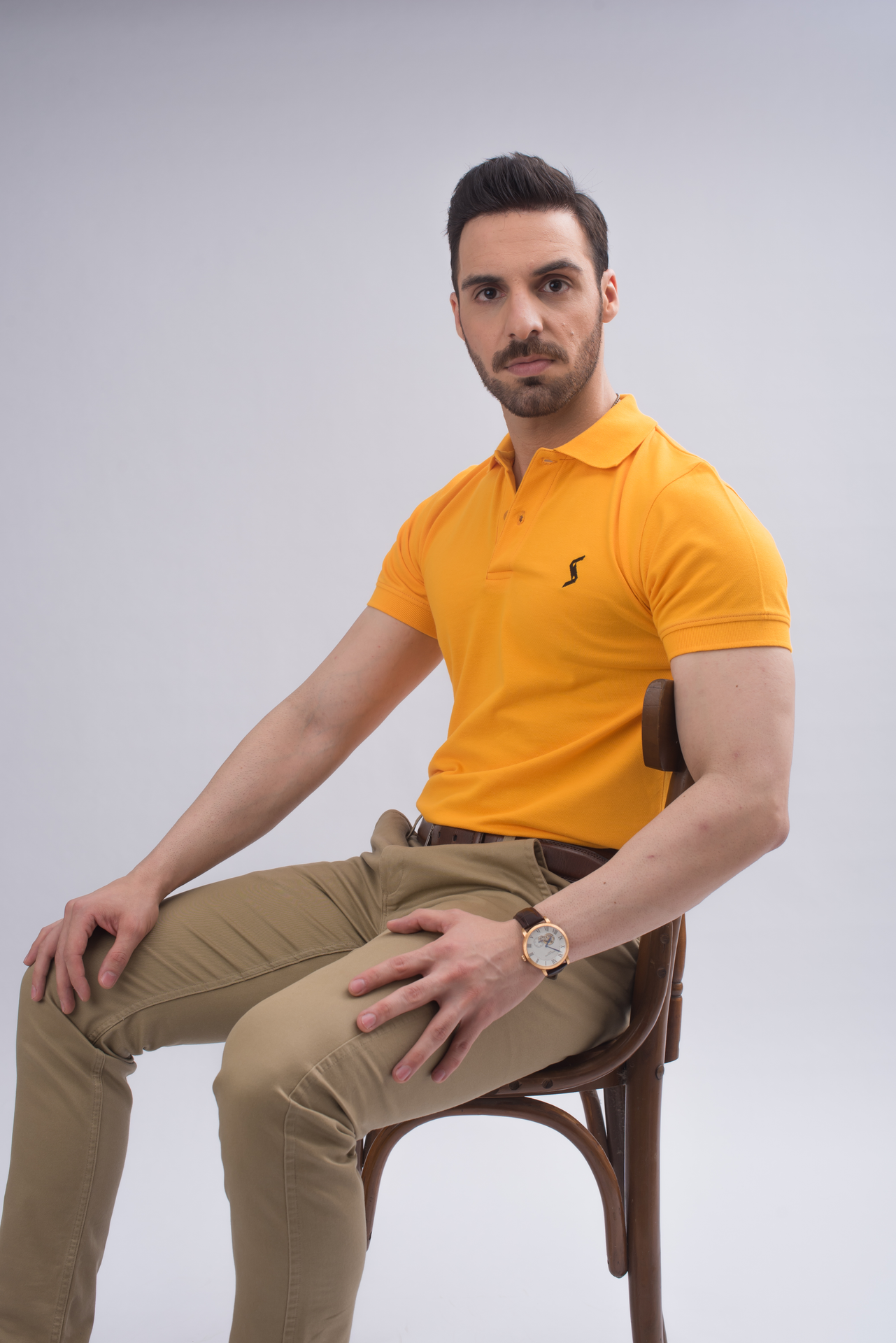 Men’s Saffron Classic Polo front view, featuring sleek spread collar and short sleeves for a bold look.