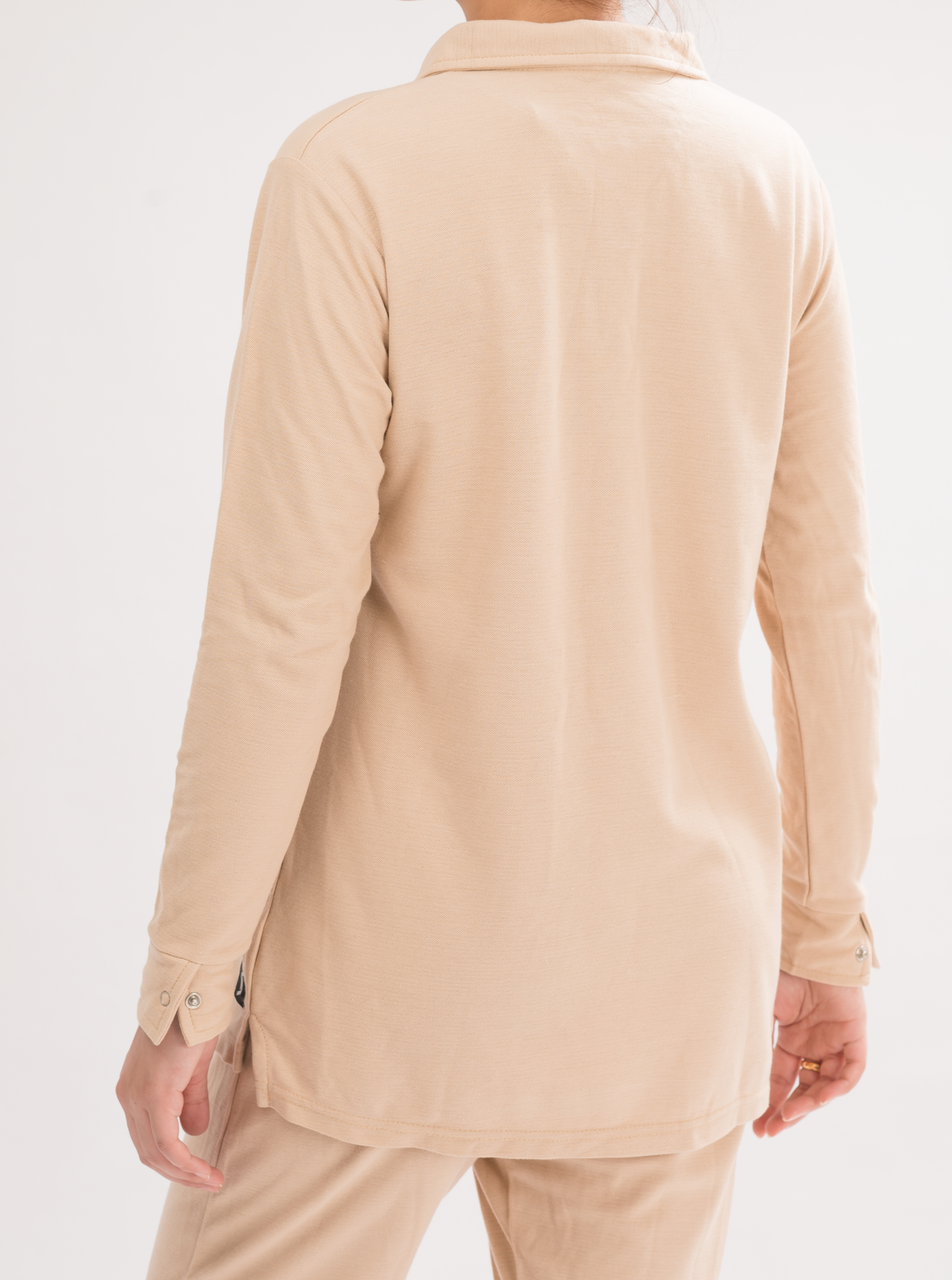 Women’s Oatmeal Long Sleeve Polo Dress Shirt back view, displaying the timeless design and smooth finish.