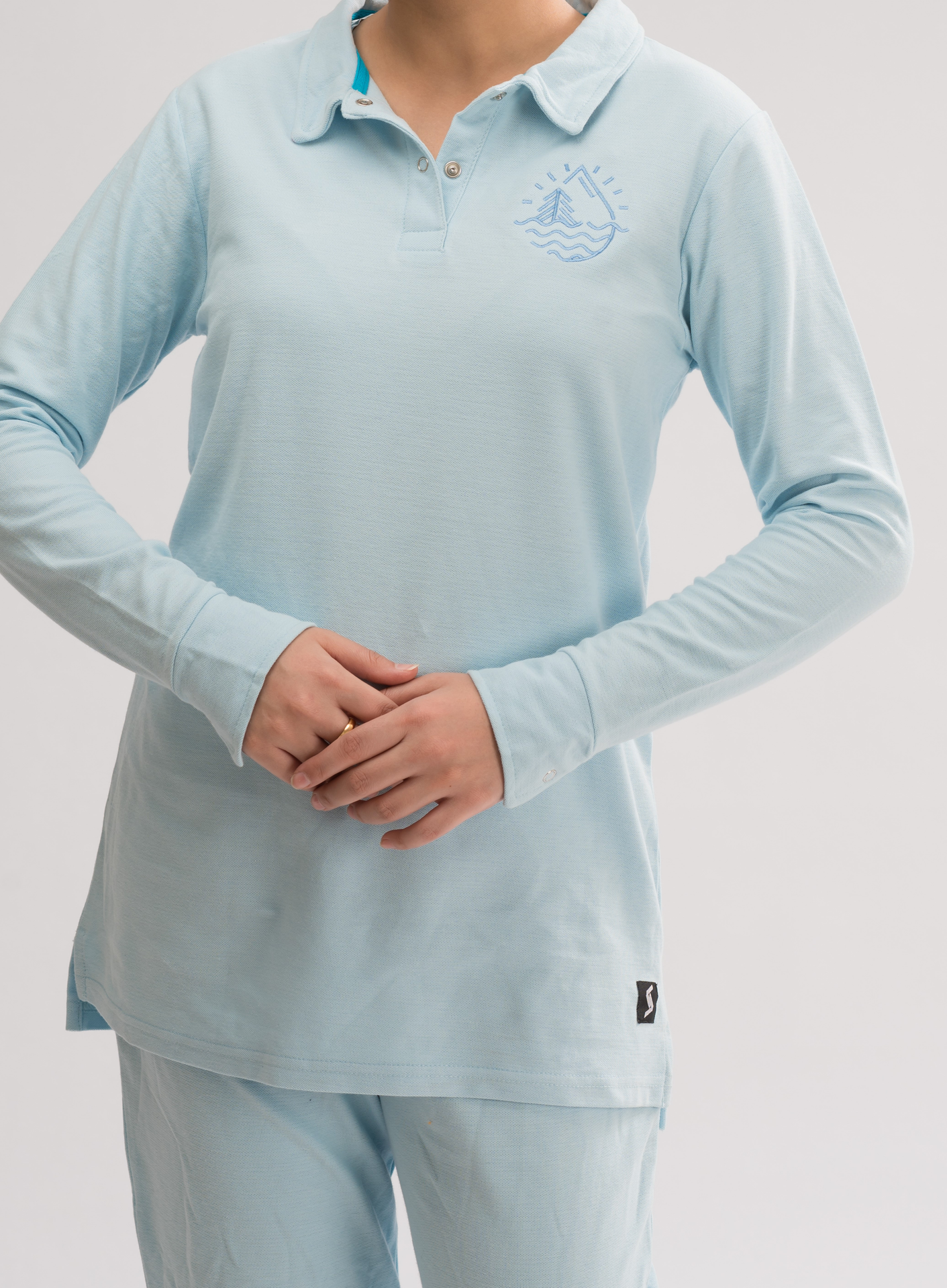 Women’s Omphalodes Long Sleeve Polo Dress Shirt front view, combining comfort and simplicity for a chic look.