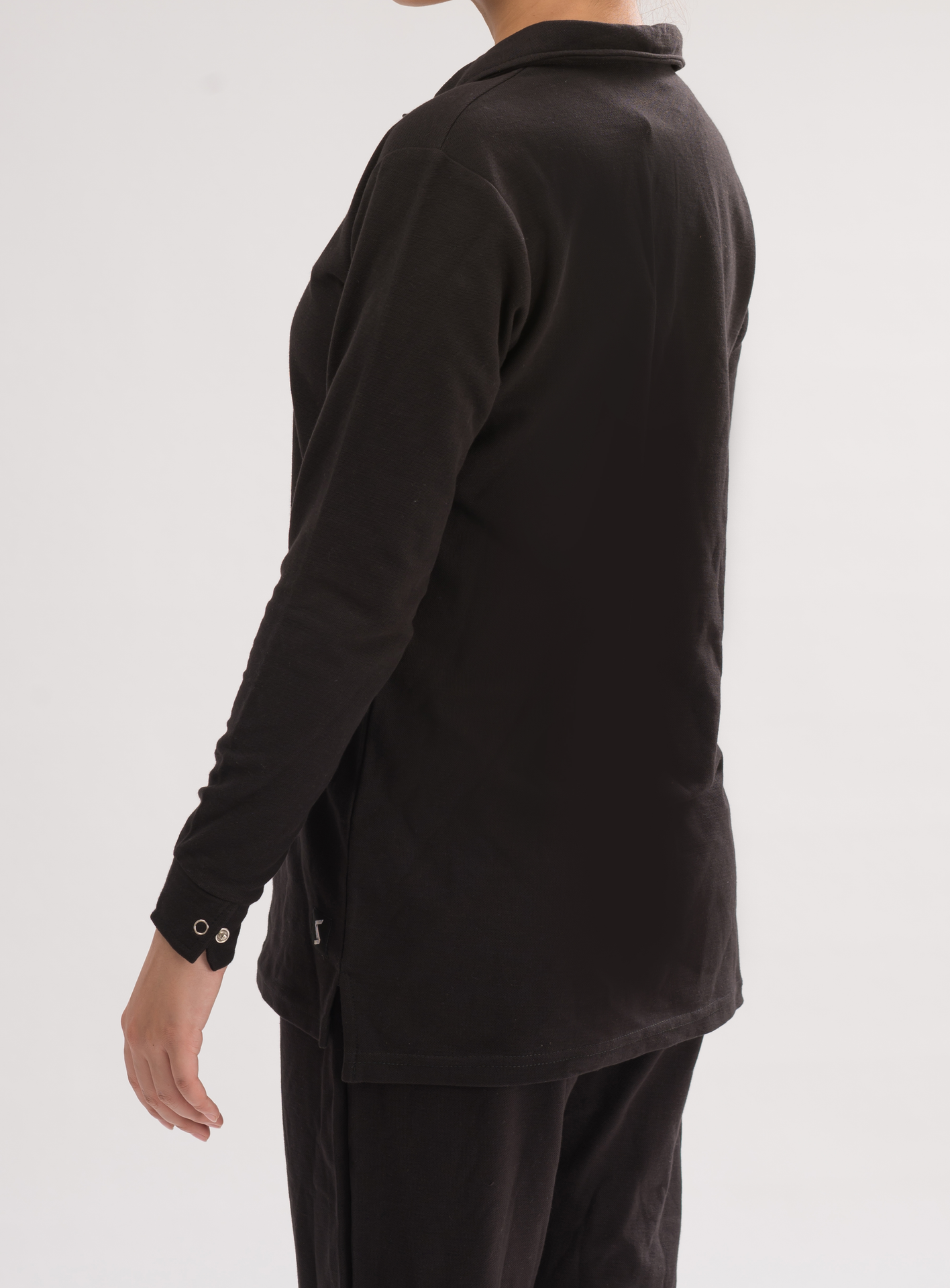 Side view of Women’s Black Long Sleeve Polo Dress Shirt, showcasing the classic design and feminine allure.