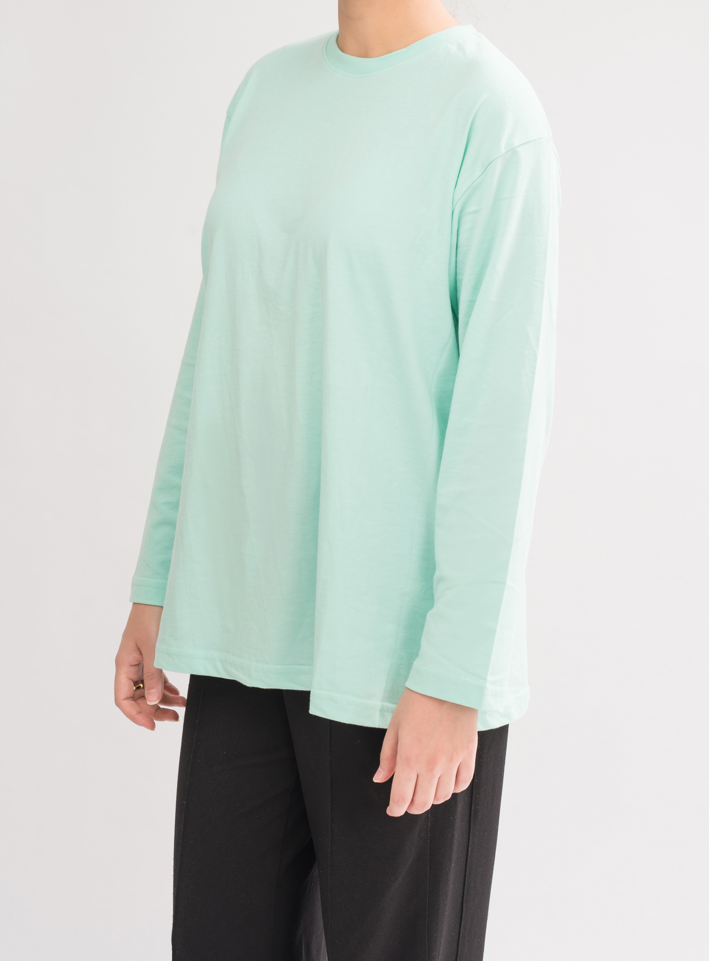 Side view of Women’s Oversized Crew Neck T-Shirt Dress in HoneyDew. Perfect for casual wear, featuring long sleeves and a relaxed fit.