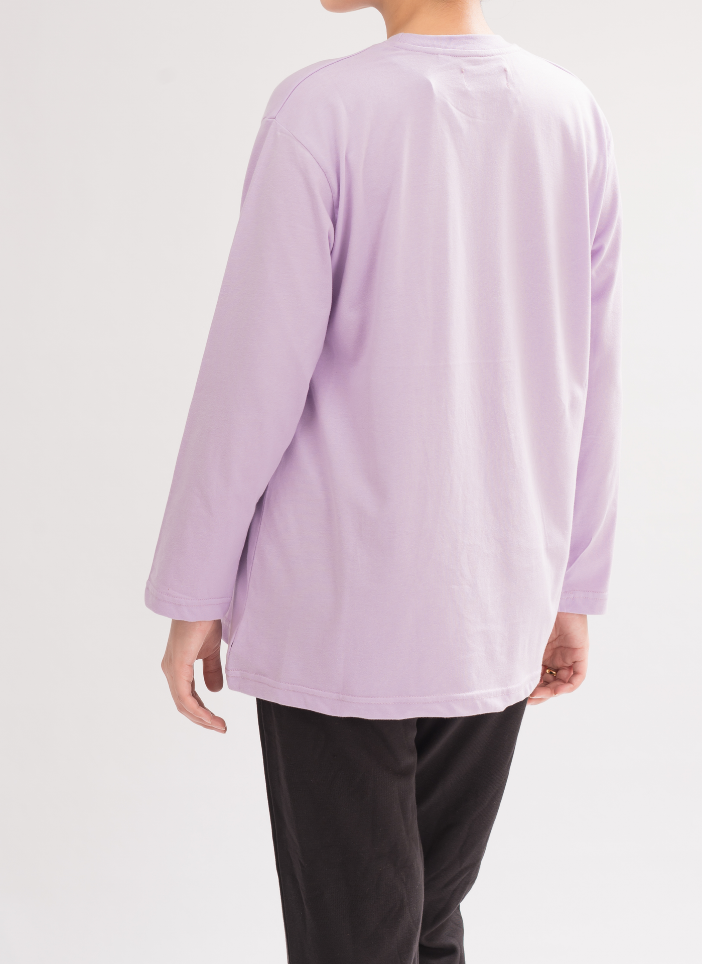 Back view of Women’s Oversized Crew Neck T-Shirt Dress in Lilac. Crew neck design with a relaxed fit for casual chic style.