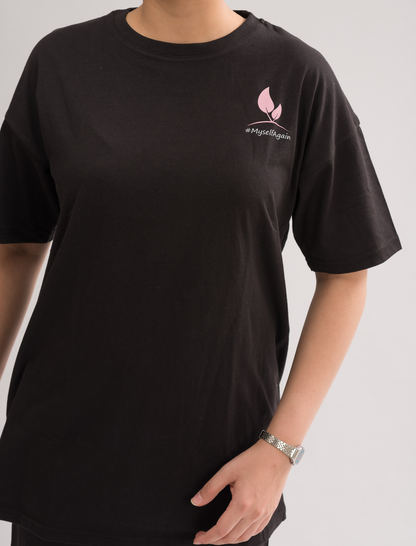 Close-up of the soft fabric of Women’s Black Oversized Crew Neck T-Shirt Dress, highlighting the comfort and quality.