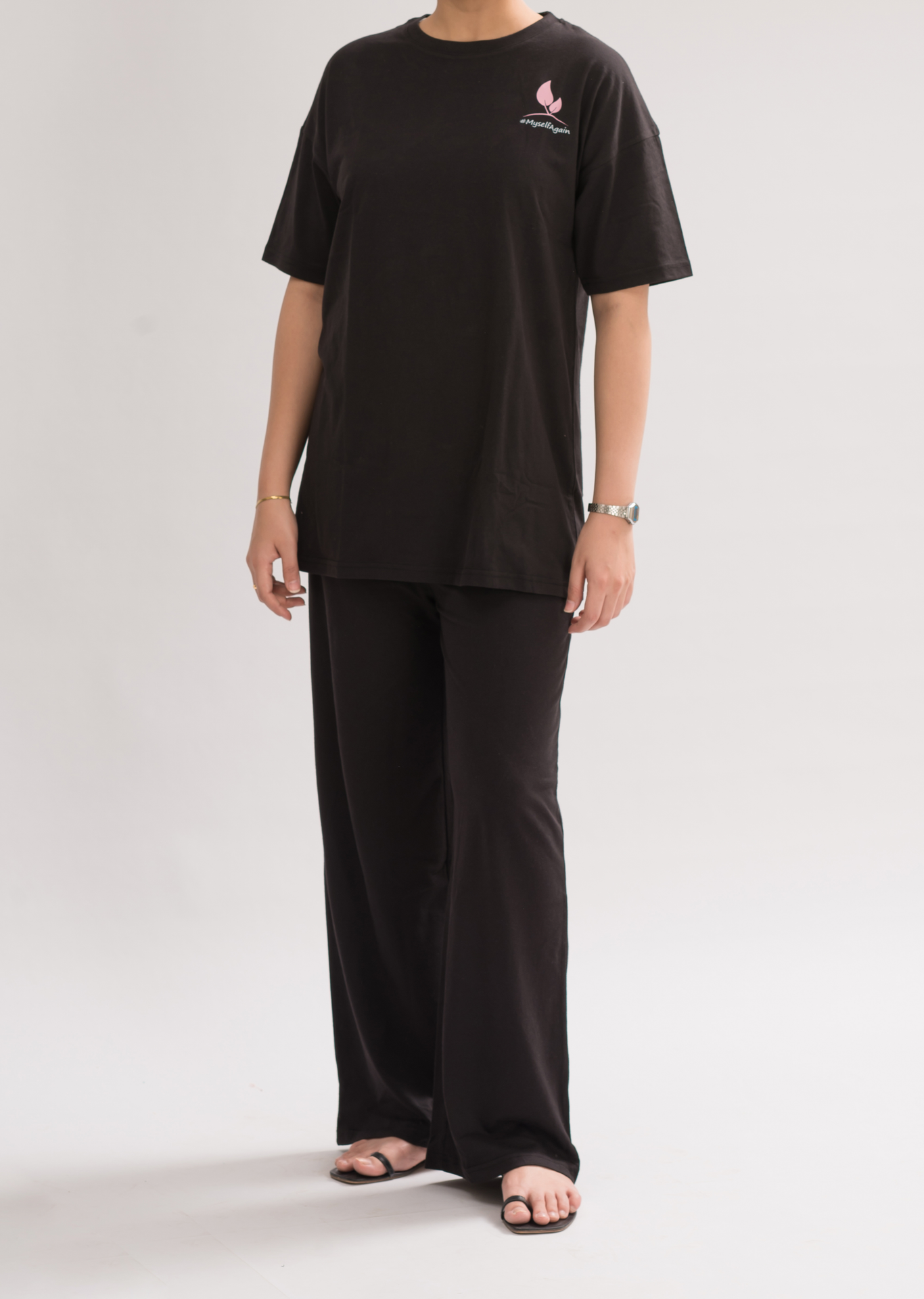 Women’s Black Oversized Crew Neck T-Shirt Dress front view, featuring a relaxed fit and half sleeves for a chic and comfortable look.