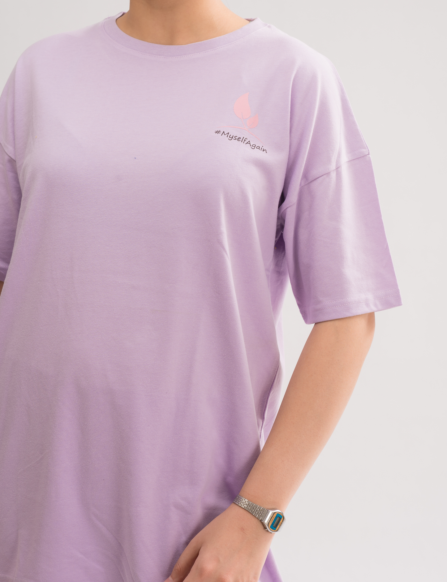 Close-up of the soft fabric of Women’s Lilac Oversized Crew Neck T-Shirt Dress, highlighting the comfort and quality.