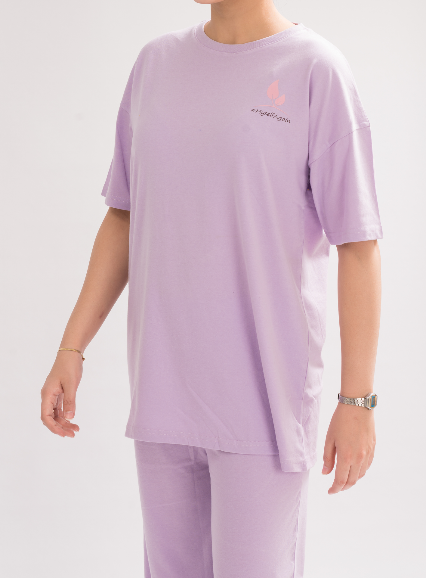 Women’s Lilac Oversized Crew Neck T-Shirt Dress front view, featuring a relaxed fit and half sleeves for a chic and comfortable look.