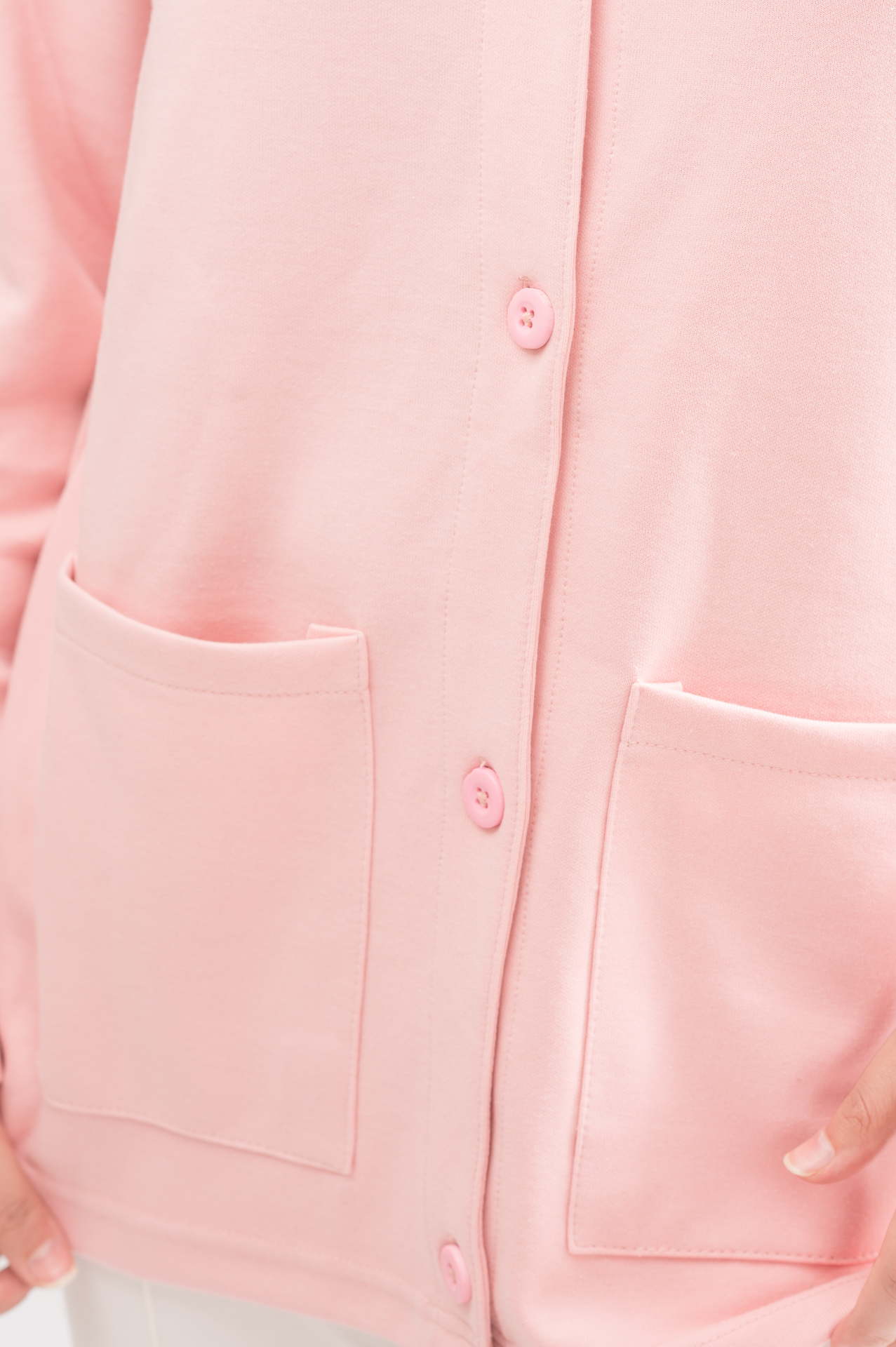 Close-up of the double-knitted fabric of Women’s Rose Pink Lightweight Cardigan, emphasizing the premium cotton blend and craftsmanship.