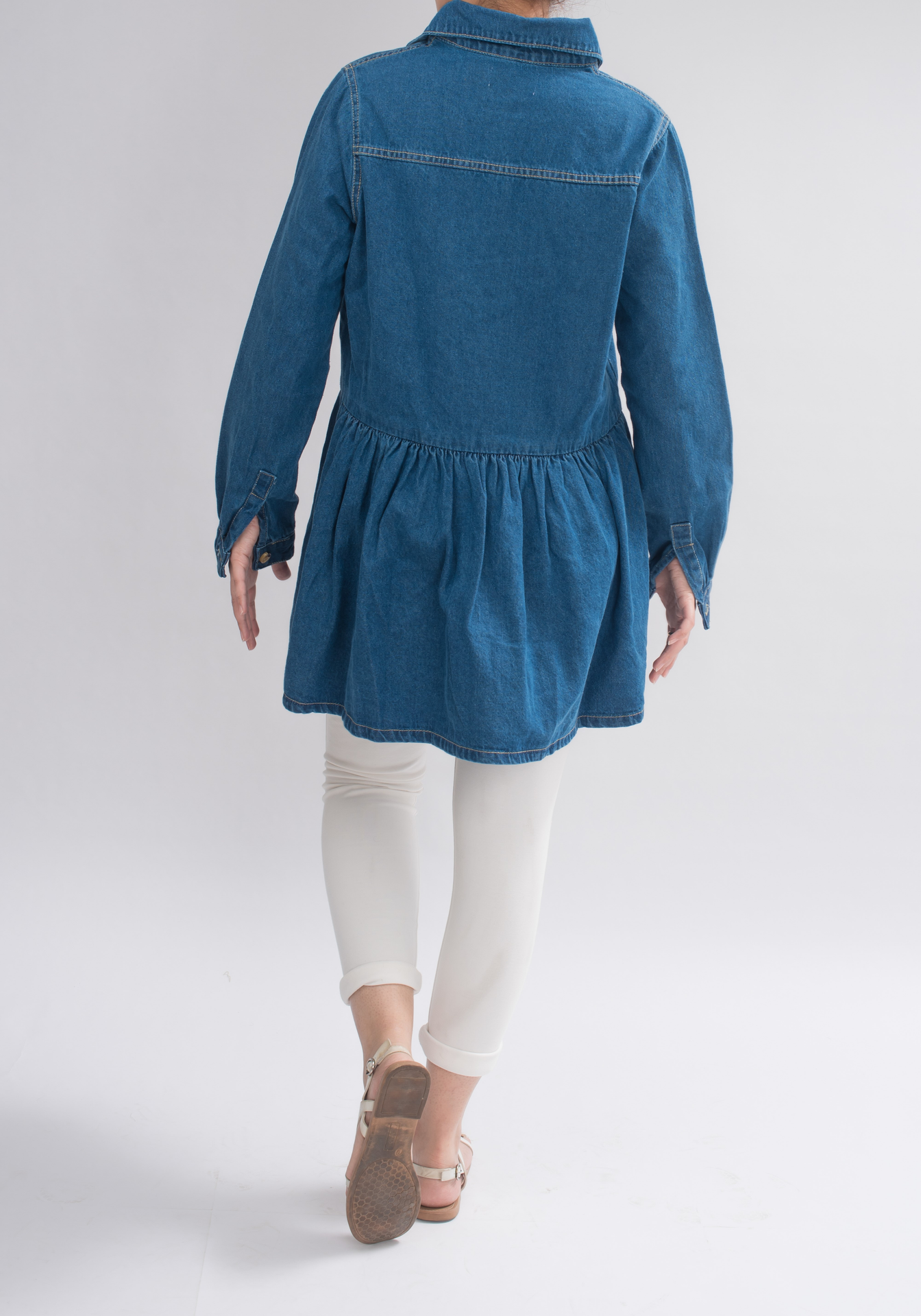 Back view of Women’s Denim Collared Dress, displaying the loose-fitting silhouette and buttoned cuffs for a statement look.