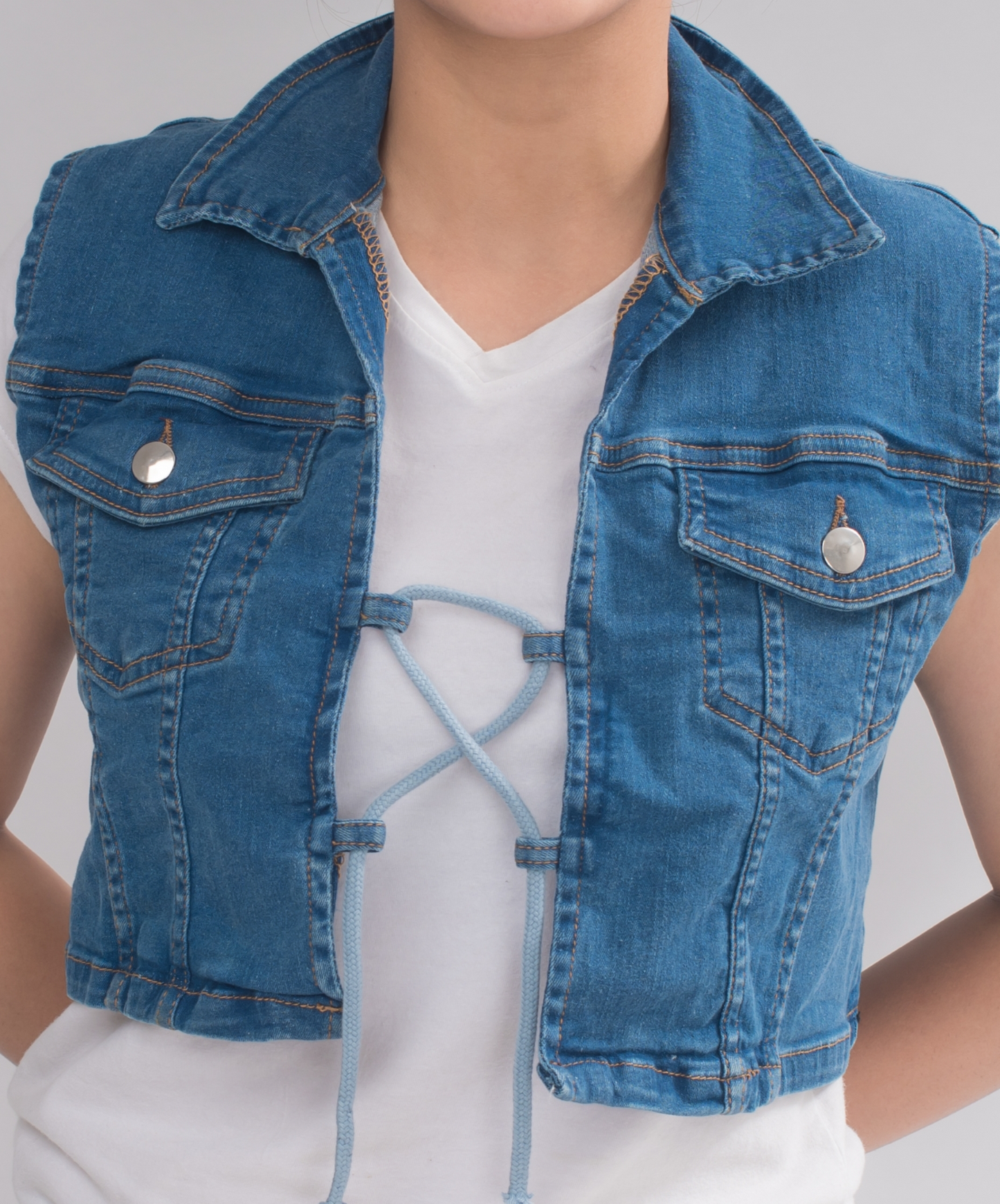 Women’s Sleeveless Double Breasted Crop Denim Jacket front view, featuring a fashionable drawstring closure and chic design.