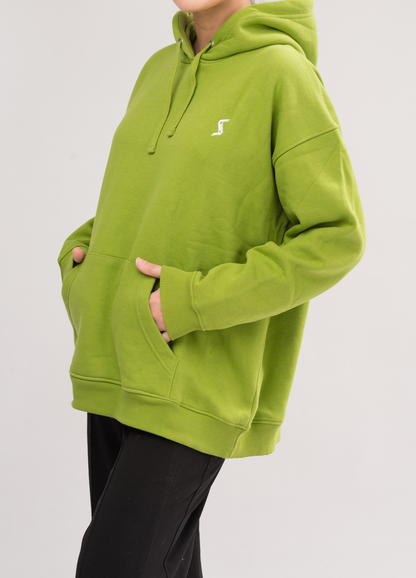 Side view of Women’s Classic Oversized Hoodie in Greenoble Green. Experience luxury with a soft brushed interior and a convenient kangaroo pocket.