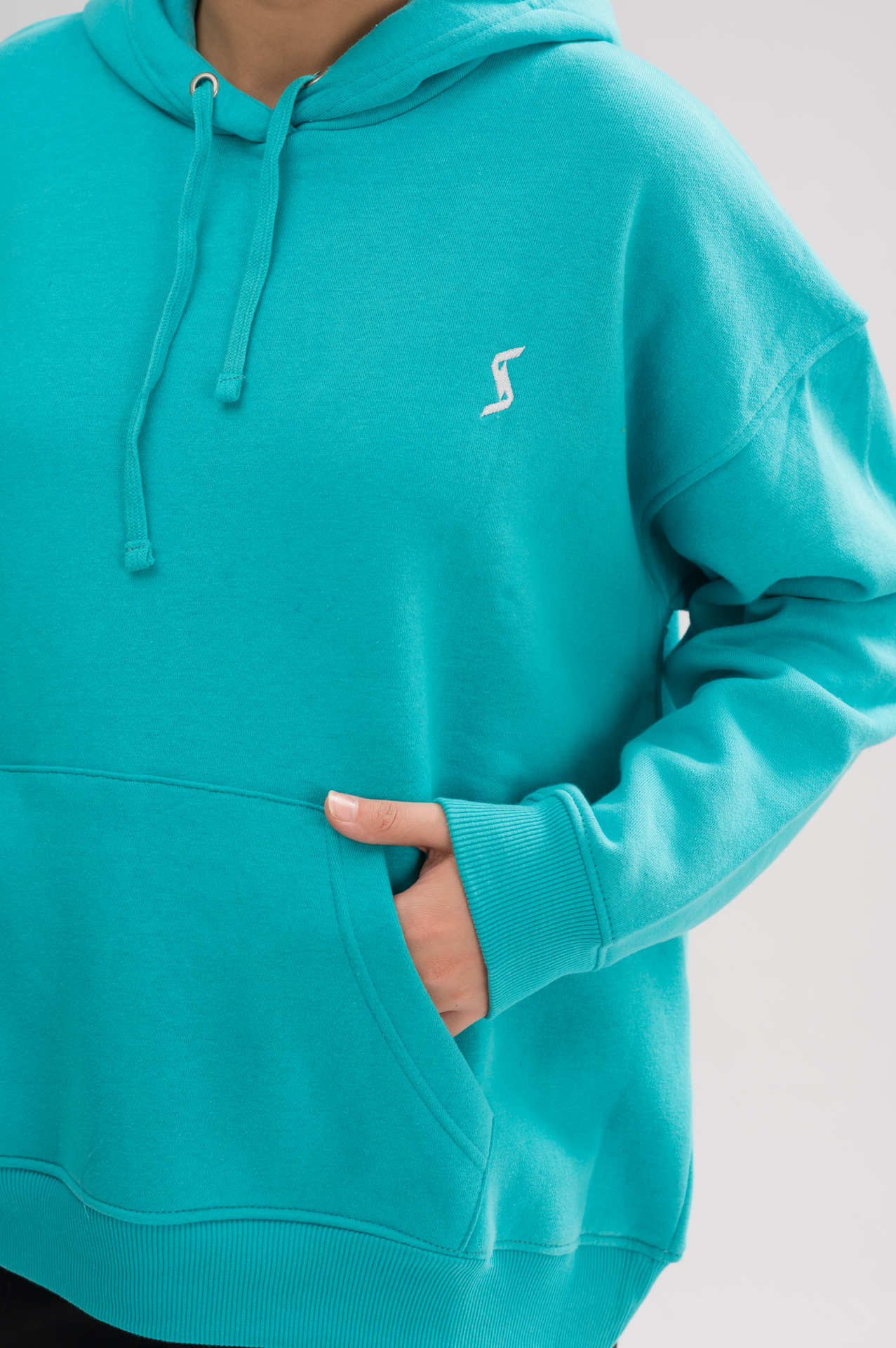 Close-up of the soft fabric of Women’s Classic Oversized Hoodie in Jade. Perfect for comfort and style with a luxurious brushed interior.