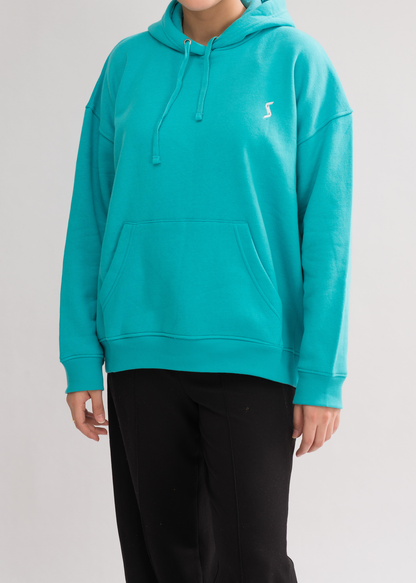 Women’s Classic Oversized Hoodie in Jade - Front View. Features a contoured silhouette, dropped shoulders, and a double-layered hood for modern casualwear.