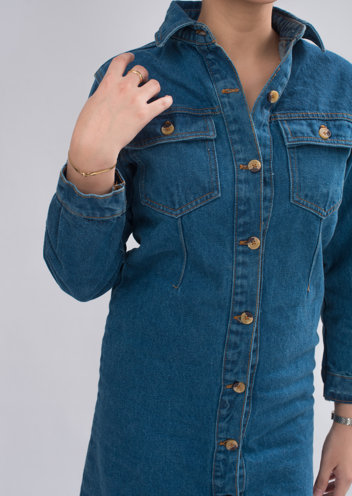 Close-up of Women’s Long Denim Shirt button-down collar, highlighting the flattering design and attention to detail.