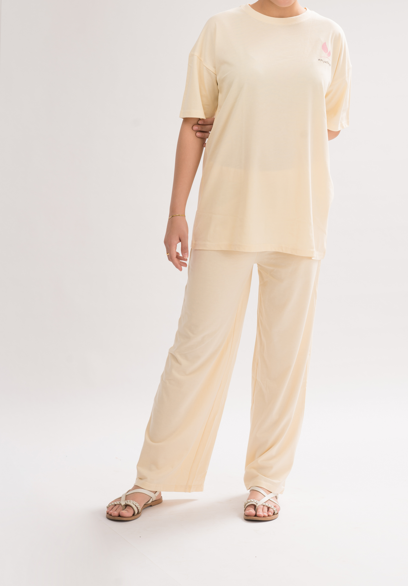 Women’s Cream White Relaxed Fit Flared Cotton Blend Trousers front view, featuring an elasticated waist and stylish flared design.